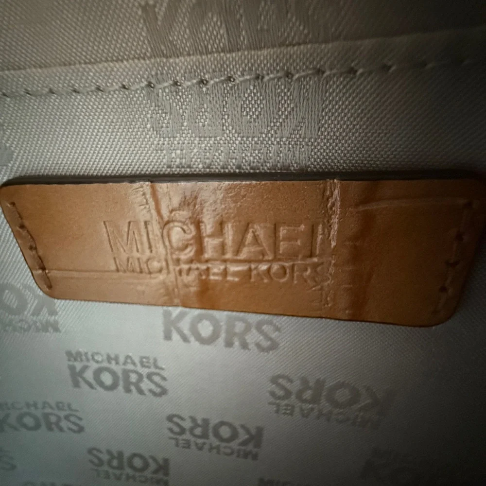 Michael Kors Wristlet Envelope style Clutch Embossed Leather Walnut color.